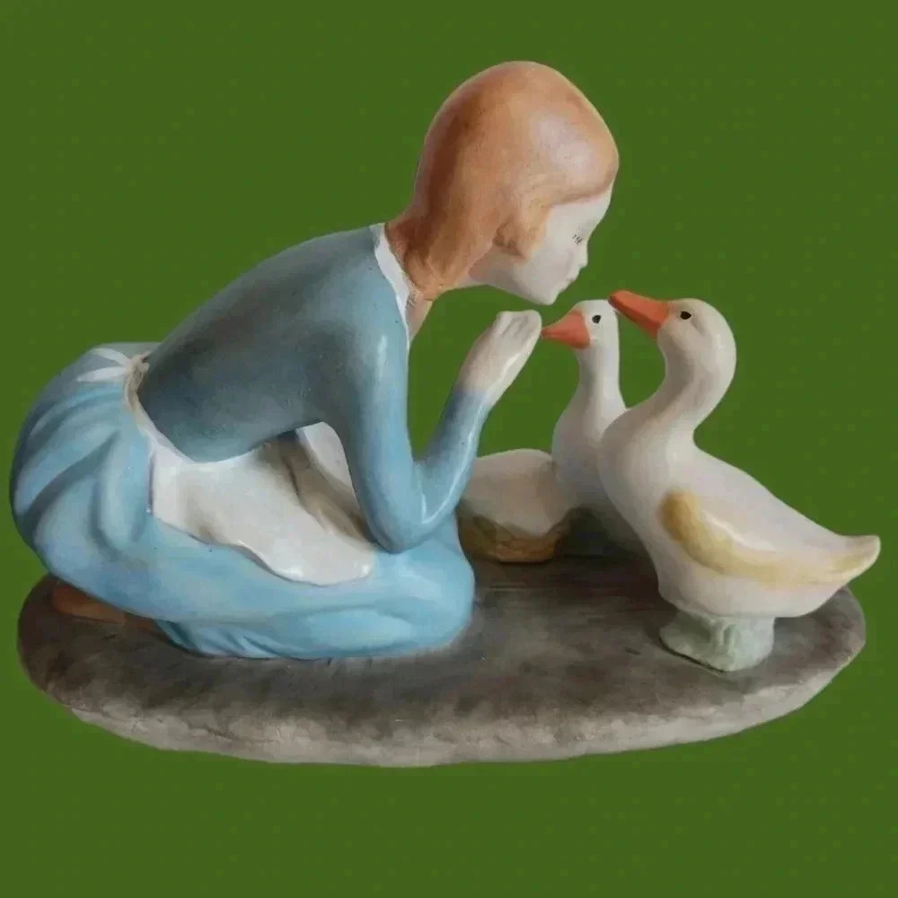 Vintage Kneeling farm girl feeding ducks figurine